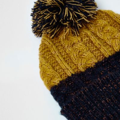 Navy and mustard twist knit bobble hat